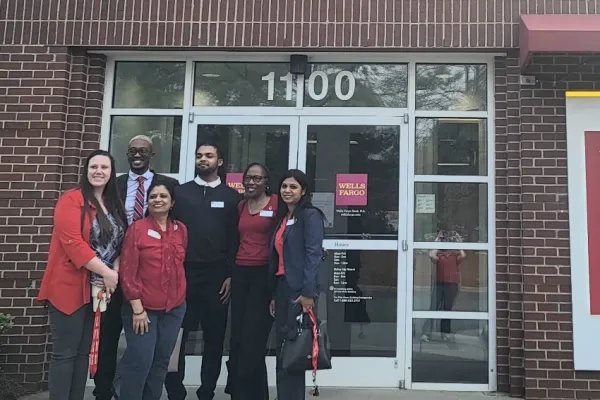 Wells Fargo workers stand outside their branch