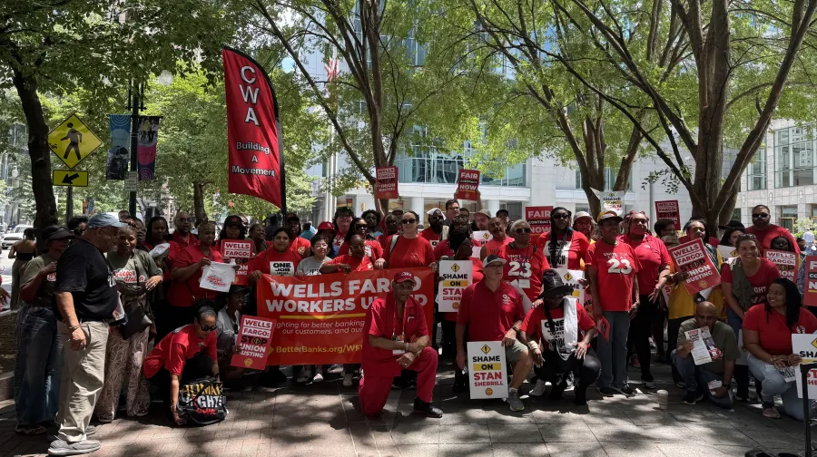 Dozens of people stand together at an AFL-CIO and Wells Fargo Workers United rally in Charlotte, North Carolina